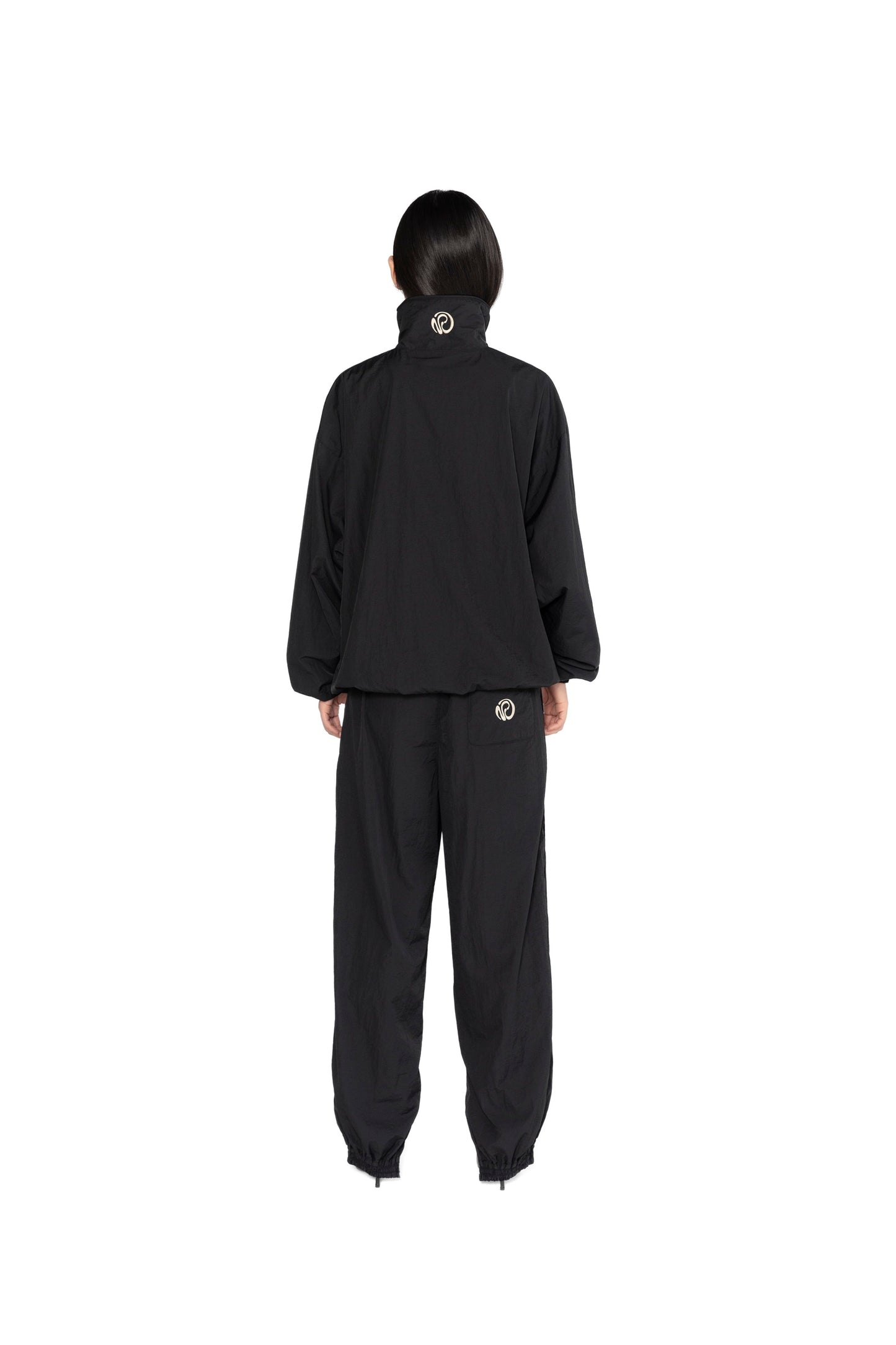 OVERSIZED TRACK PANTS.