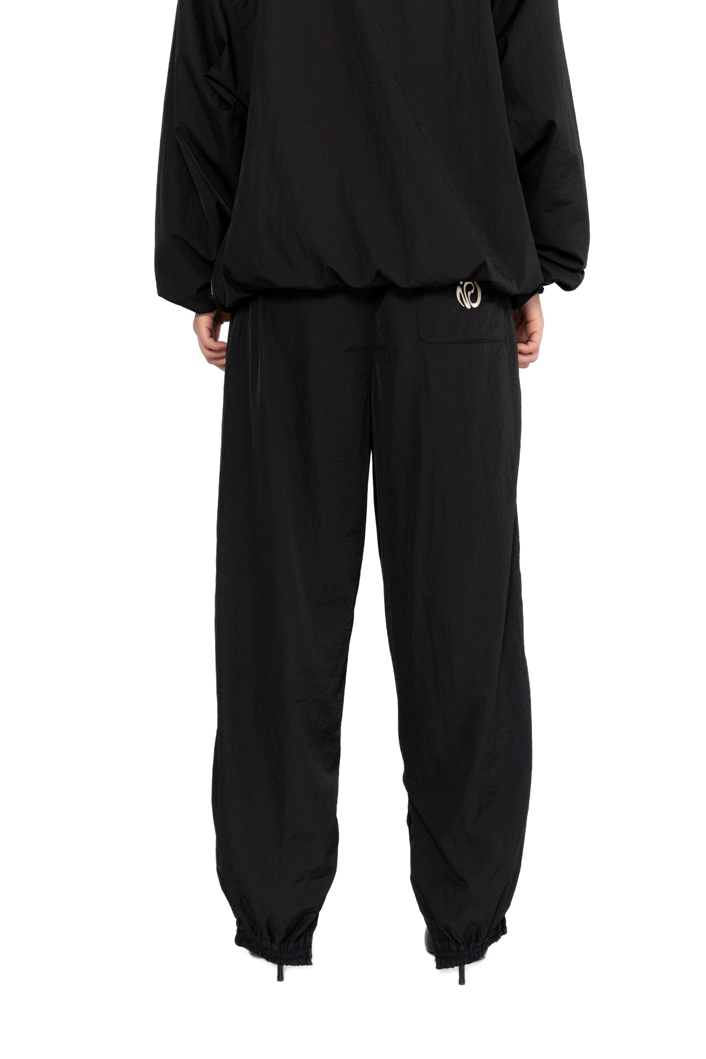 OVERSIZED TRACK PANTS.