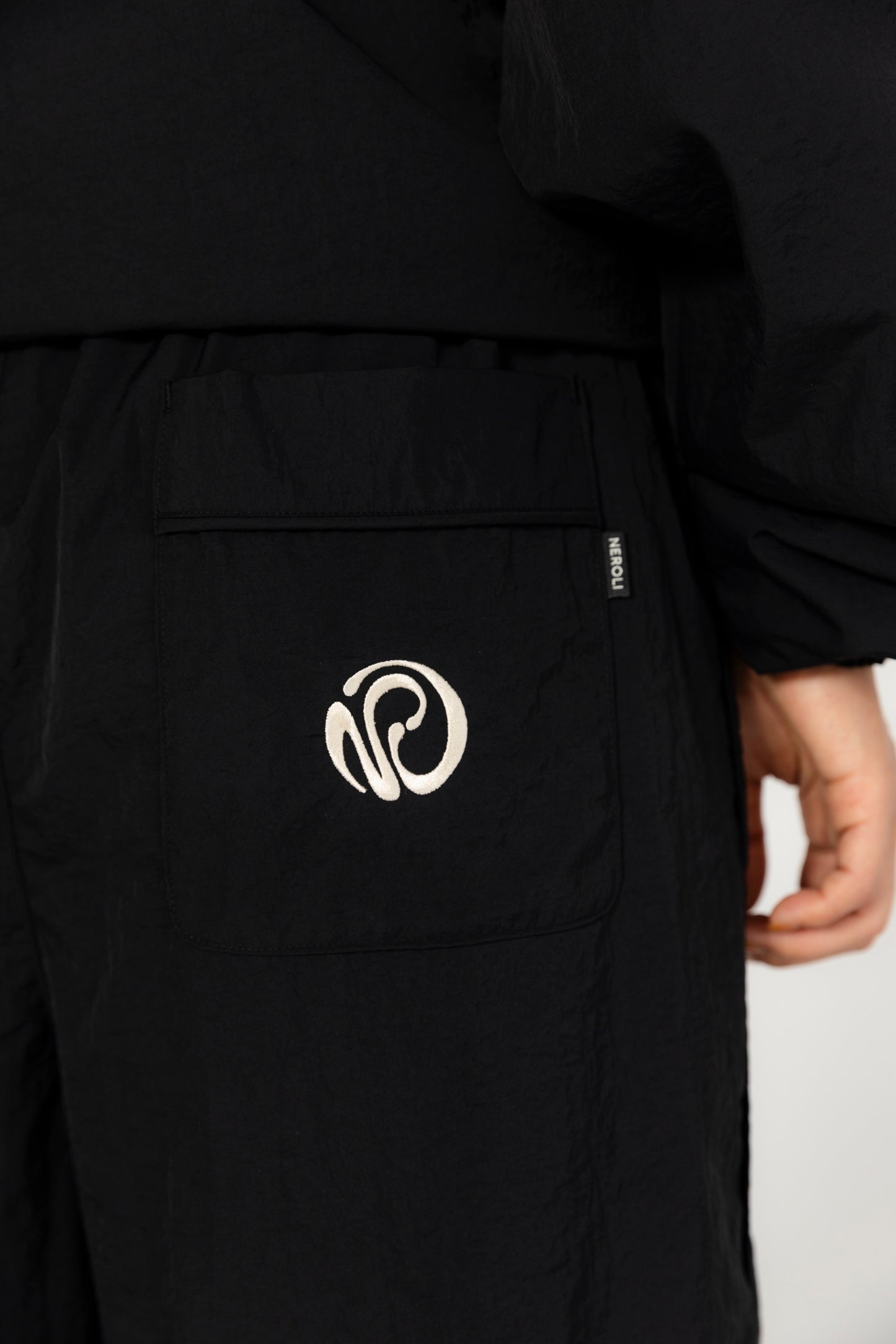 OVERSIZED TRACK PANTS.